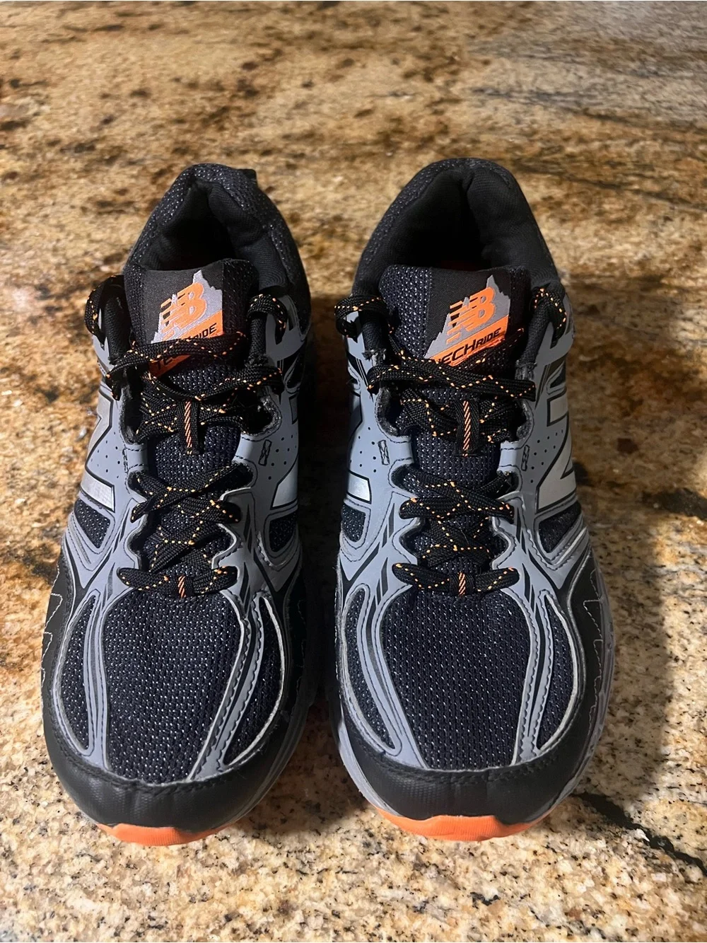 New Balance Men’s Black and Gray Athletic Trail Shoes with Orange Accents